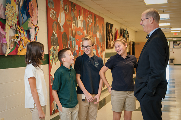 superintendent of Fredericksburg Christian School talking to students